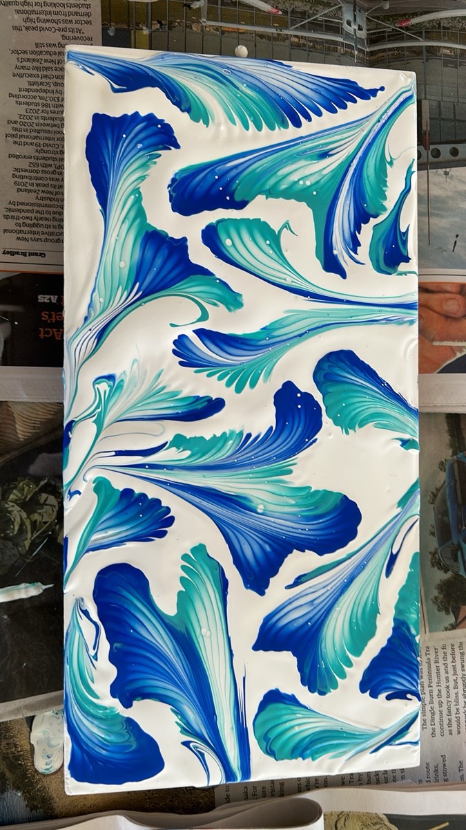 Blue and teal fluid pour painting